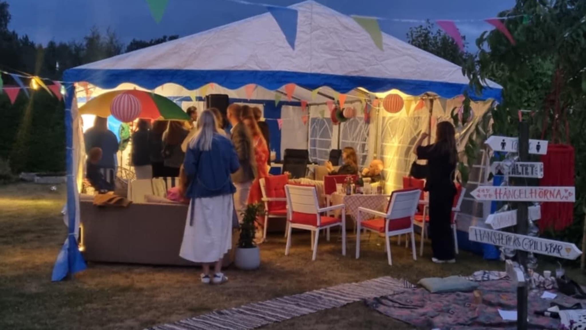 People in a party tent